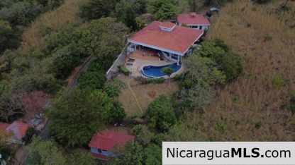 Landmark entertainer home in a quiet, gated development mere minutes from town