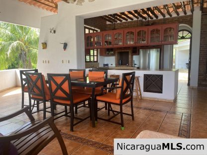 Landmark entertainer home in a quiet, gated development mere minutes from town