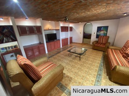 Landmark entertainer home in a quiet, gated development mere minutes from town