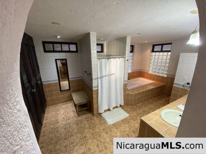 Landmark entertainer home in a quiet, gated development mere minutes from town