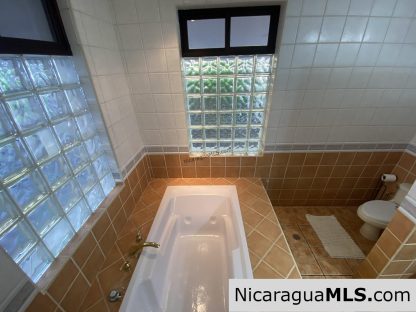 Landmark entertainer home in a quiet, gated development mere minutes from town