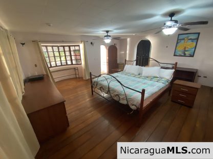 Landmark entertainer home in a quiet, gated development mere minutes from town