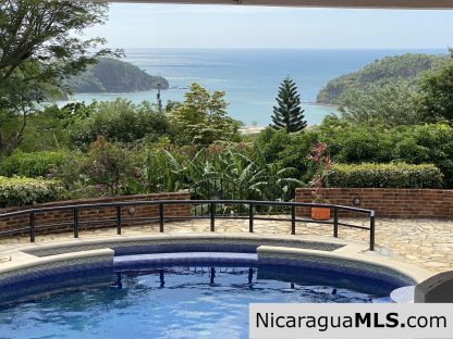 Landmark entertainer home in a quiet, gated development mere minutes from town